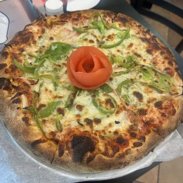 Veggie pizza fresh out of the oven on the pan